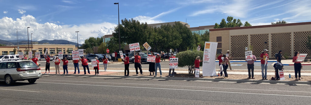 Members of CWA Local 7076 Members of CWA Local 7076 protest outside the Willie Ortiz Building on September 19, 2025, advocating for fair pay, a fair contract, and remote work, highlighting issues of gaslighting in negotiations.